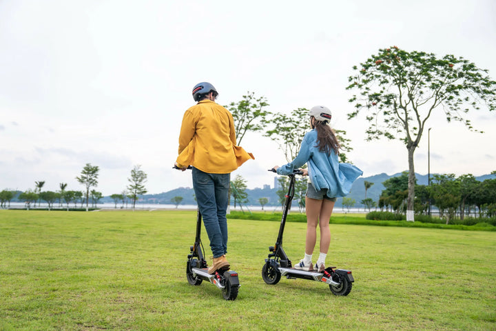 KuKirin scooter group ride in an urban park