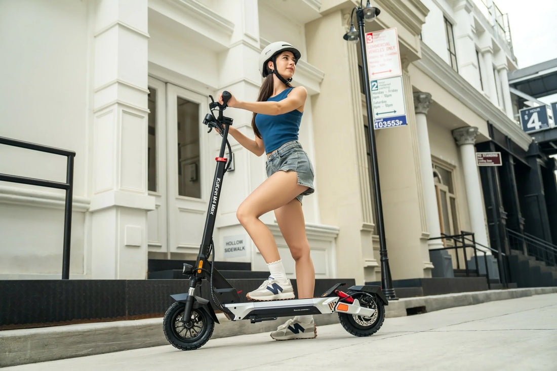 KuKirin electric scooter rider commuting on a UK city street
