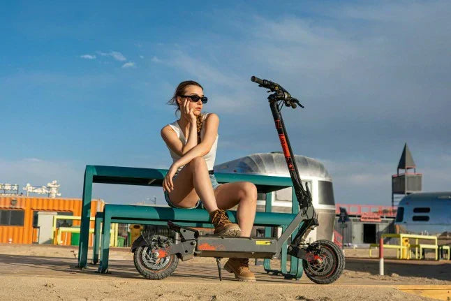 KuKirin G2 Ultra electric scooter parked beside modern city landscape