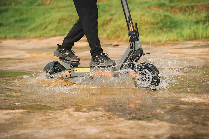 Kukirin electric scooter riding through an open countryside road