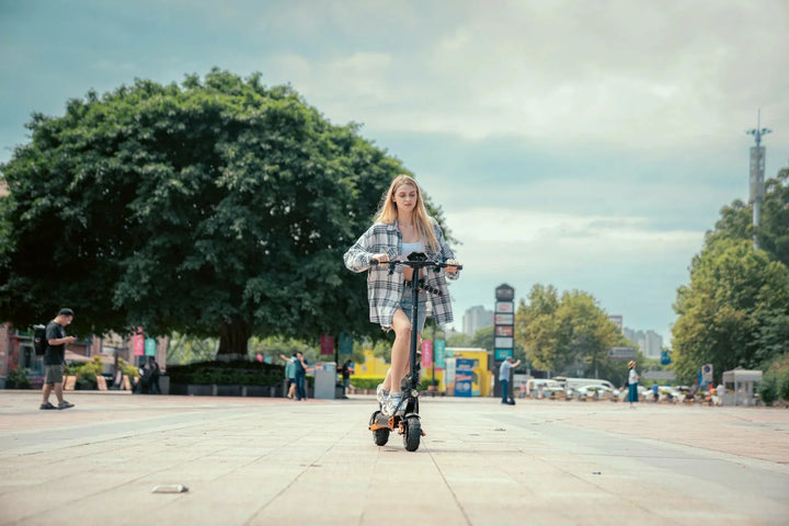 Kukirin electric scooter rider using the controls during an urban ride