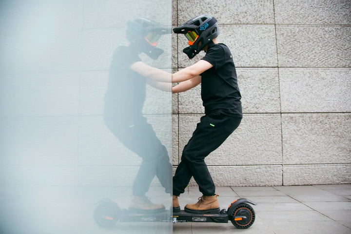 KuKirin electric scooter rider commuting through city streets